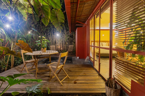 Patio -  Unwind in tropical bliss with the warmth of a crackling firepit and the gentle embrace of lush greenery. Bask in golden sunlight on our comfy loungers, where serenity meets style. 🌿🔥 #TropicalRetreat #CozyEscape