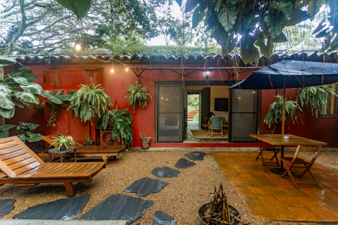 Patio -  🌿 Escape to serenity in this lush retreat! With warm, inviting lighting and cozy outdoor lounging spaces, every moment here feels like a peaceful getaway. Enjoy dining under the stars or unwind on our comfortable loungers surrounded by vibrant gr