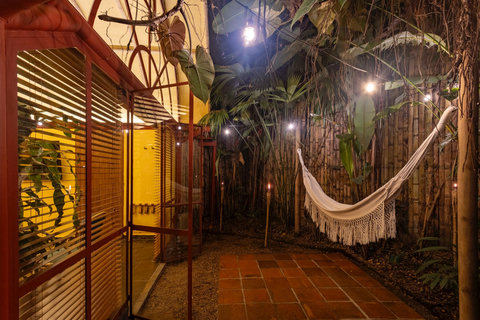 Patio - Unwind in our enchanting garden oasis, where warm lighting and lush greenery set the stage for ultimate relaxation. Lounge in the cozy hammock and let the serene ambiance whisk you away to paradise!