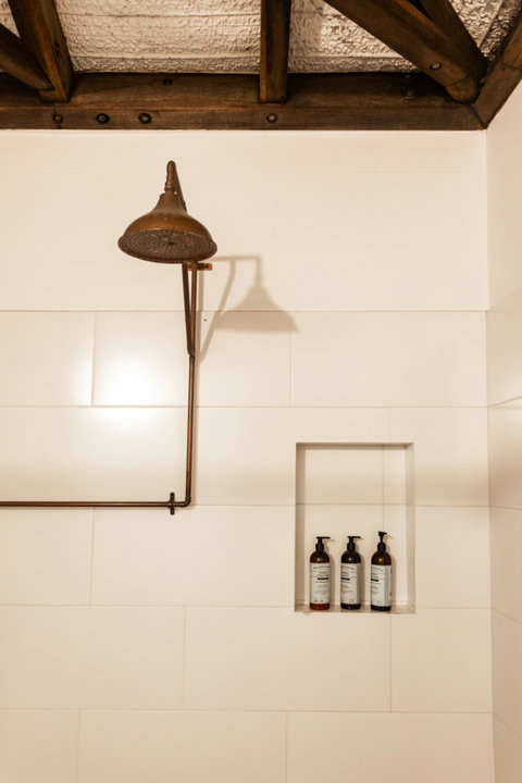 Bathroom Shower - Bathroom - Step into rustic charm infused with modern elegance. Our bathroom features artisanal decor and soft lighting that create a serene retreat. Perfect for unwinding after a day of adventure.