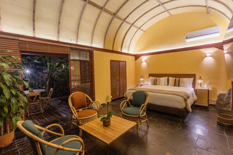 Bedroom 2 - Bask in the warm glow of tranquility in this stunning retreat. With its inviting lighting and lush surroundings, this cozy escape is the perfect blend of comfort and nature. Unwind in style and enjoy all the serene comforts this charming space