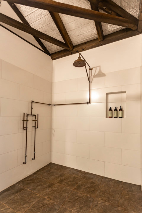 Bathroom  -  Experience rustic charm blended with modern elegance. This thoughtfully designed bathroom features artisanal accents and soft lighting, creating a calm and inviting retreat—perfect for relaxing after a full day of adventure.