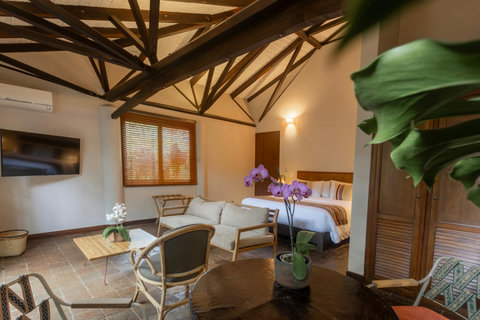 Bedroom 2  - 🌿 Embrace tranquility and comfort in this charming retreat, where the warm glow of ambient lighting enhances the rustic beams and cozy interiors. Indulge in the perfect blend of nature and luxury—an ideal escape awaits! 🌇✨