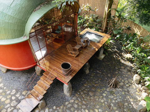 Balcony hot tub - Step into a world of serene relaxation where nature meets luxury. Bask in the golden sunlight pouring through expansive windows as you unwind on your private deck, complete with invigorating hot tub and lush views. This enchanting retrea