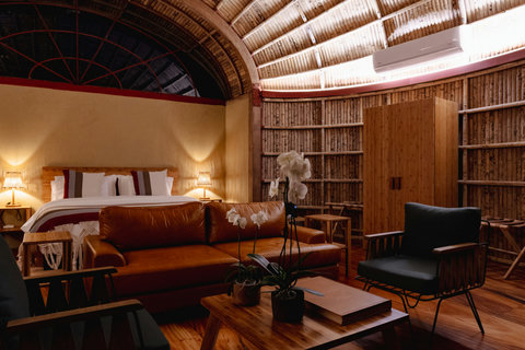bedroom 3 - Unwind in this serene oasis where rustic charm meets modern comfort. Bask in the warm glow of ambient lighting that highlights the elegant bamboo architecture. Perfect for a cozy retreat, this space is your sanctuary of tranquility and style.