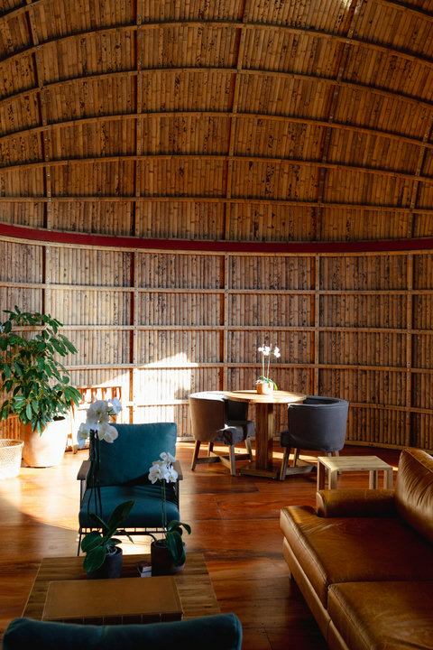 Bedroom 3 - Bask in the warmth of natural light filtering through our stunning bamboo architecture, creating a serene oasis perfect for relaxation and rejuvenation. With cozy seating and lush green accents, this space invites you to unwind and savor the t