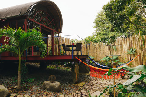 terrace - Escape to serenity in this unique eco-retreat nestled among lush greenery. Enjoy morning coffee on your private deck and afternoons lounging in the vibrant hammock. Experience tranquility with a touch of nature and modern comfort.