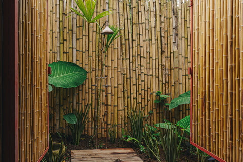 bathroom 2 - Step into your own bamboo sanctuary where serenity meets luxury. Bask in the gentle glow of natural light and unwind with a refreshing outdoor shower surrounded by lush greenery. Pure bliss awaits.