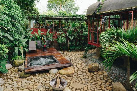patio hot tub - Unwind in your private tropical sanctuary 🌿✨ Surrounded by lush greenery, this hidden gem offers a serene escape with its cozy hot tub and inviting outdoor seating. Experience the perfect harmony of nature and comfort, where tranquil vibes