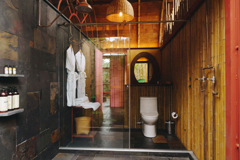 bathroom 1 - Step into a serene oasis where rustic elegance meets modern comfort. Immerse yourself in the warm glow of ambient lighting, unwind in luxurious robes, and indulge in premium amenities as you escape into this tranquil retreat.