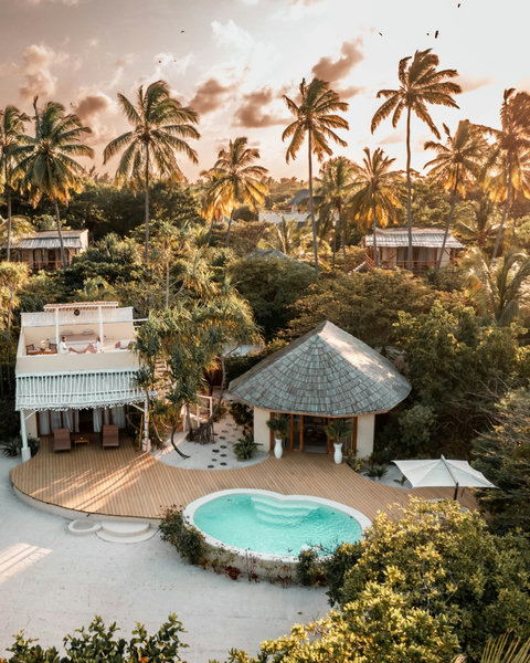 From this angle, the whole escape feels hushed and golden, with the pool holding the last of the light.