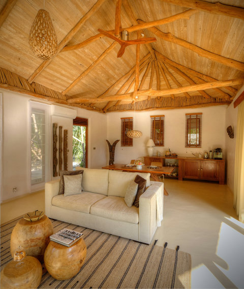 Ease into the stay beneath sculpted timber ceilings, where warm light, quiet textures, and slow conversation set the mood.
