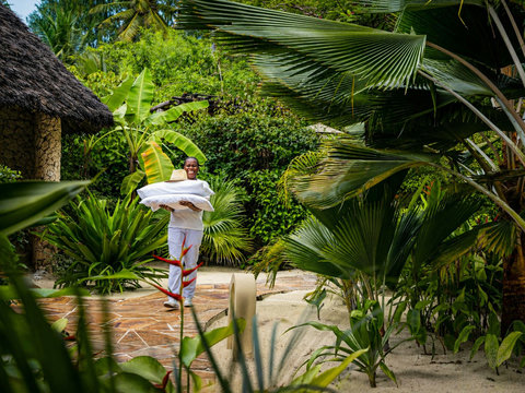 Return through lush paths to fresh linens and quiet care, with every detail handled before you even ask.