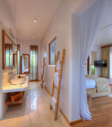 Soft light, warm wood, and an easy flow from bed to bath make every morning feel calm, polished, and effortless.