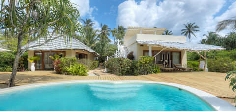 Morning returns easy here, with the pool sparkling outside and every path leading back to shade, water, and calm.