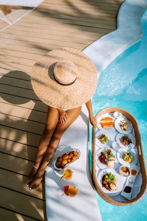 Breakfast arrives by the water, sun on skin, citrus in hand, and nowhere else you need to be.