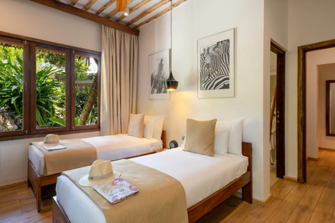 Night arrives softly here, with warm bedside glow, cool sheets, and the kind of stillness you notice immediately.