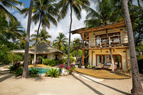 The villa opens gently around you, all sunwashed wood, filtered light, and the calm promise of hours with nowhere else to be.