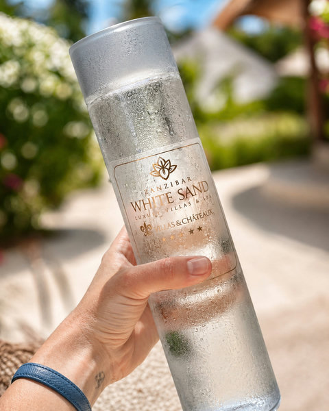 Even the water feels considered here, chilled, sunlit, and refreshing in a way that belongs entirely to this climate.