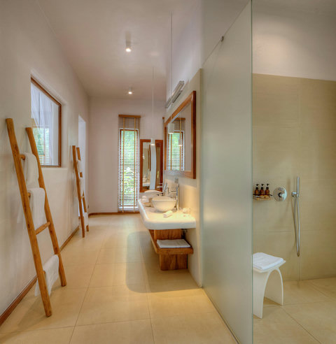 Light stretches longer now, skimming the floor and mirror, turning the simplest routines into something soft and beautifully slow.
