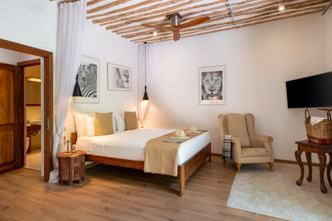 As daylight softens, warm wood and pale textures hold the last glow, inviting an unhurried evening in.