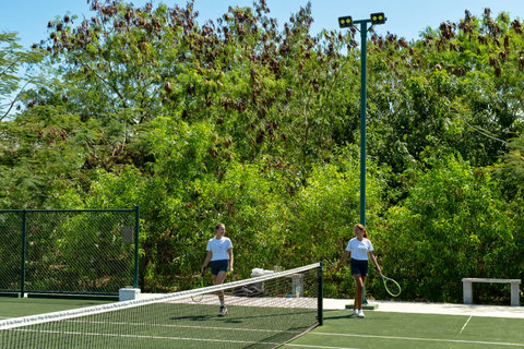 A little play in the heat of day, green courts, easy laughter, and no reason to rush.