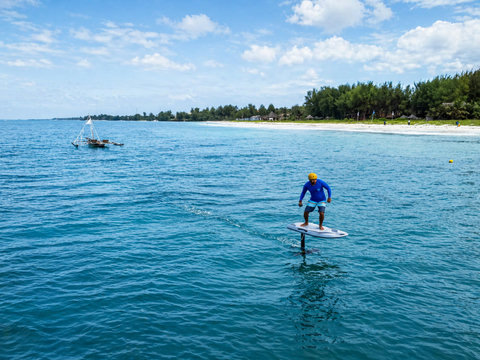 E-Foil Glide above the water on an electric hydrofoil board—exhilarating for thrill-seekers. Paid sessions include a complimentary 30-minute spa massage.