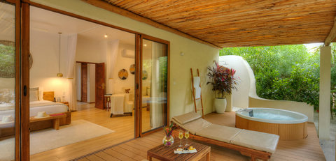 Doors slide open, shade settles in, and the terrace becomes your private pause between warm air and cool water.