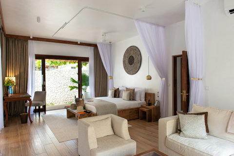 Step inside, airy drapes and pale textures invite a slow drop of bags and a deeper breath