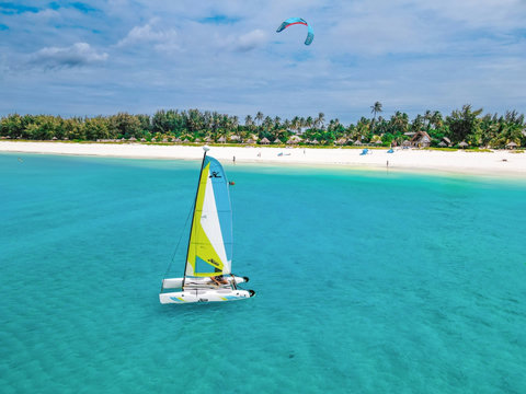 hen the water deepens to glass, and the afternoon drifts by beneath a sail, bright, breezy, and easy.