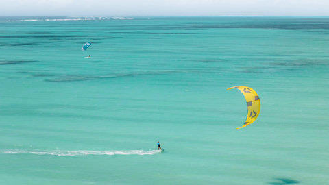 Soon the breeze turns playful, and the sea pulls you outward, all turquoise hush, motion, and sunlit freedom.