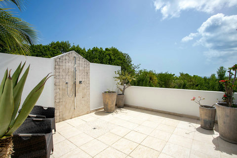 Private outdoor patio (including outdoor shower) of Bedroom 5
