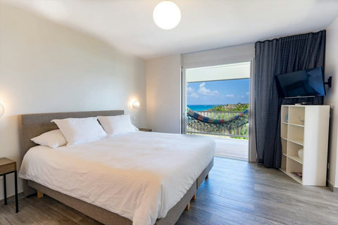 Bedroom on lower level, take stairs next to the Pool (Exterior Access only)
