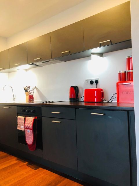 Welcome to the kitchen area. 
Enjoy tea and coffee. 
Utensils, pans, pots, cups, glasses, plates,  and cutlery are in the cupboards.
Toaster, cattle, breadbasket, microwave, dishwasher, and fridge are for your comfortable stay. 
Clean towels. 