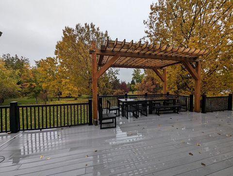 Enjoy dinner with family and friends on the outdoor patio under the pergola string lights