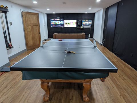 Game room with ping pong, pool, air hockey, and 3 televisions and Nintendo switch