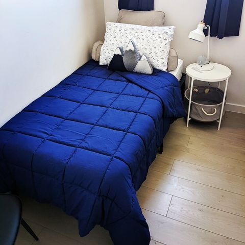 The Jefferson room, small and private with a twin bed and chair.