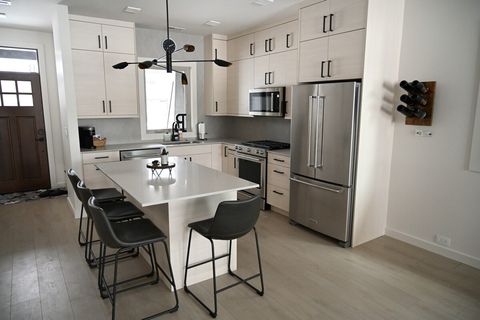 Fully stocked kitchen with brand new everything and 4 chairs to eat around the island. Keurig and Nespresso machines. Wine rack. 
