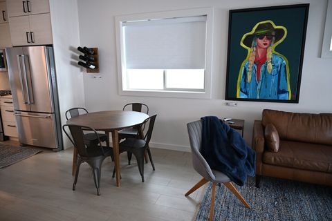 Enjoy this smart space and use your voice to control everything from the door, to the lights, and even the shades. "Alexa, lower the dining room shade"