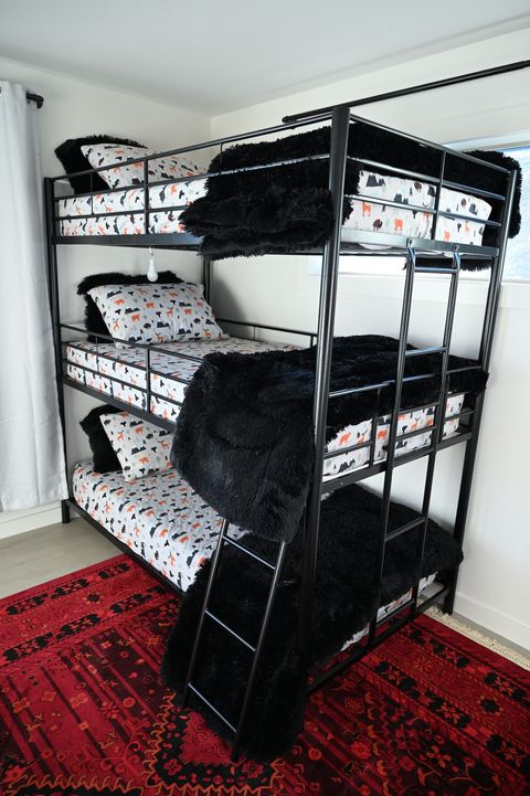 Super fun kids room with a triple bunk bed, 55" television, and Nintendo Switch