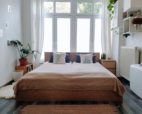 Bedroom with king size bed and shutters
