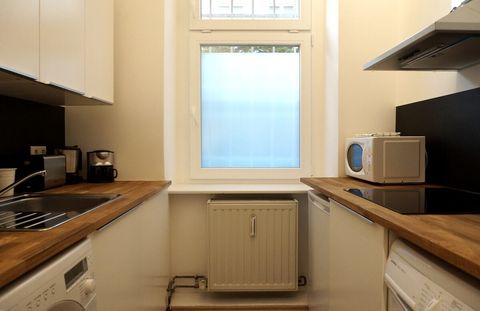 Kitchen with washing machine and dryer