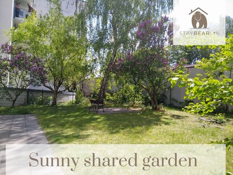 Directly in front of the entrance is a sunny shared garden.