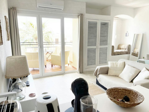 Sudio: View from shelf to sofa and balcony.