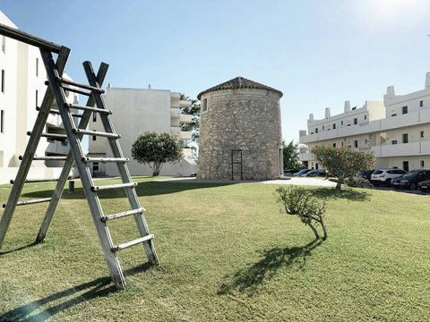 Garden: View to historic windmill and playground