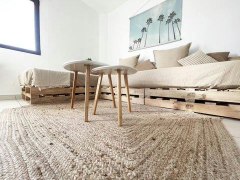 Living room: View to the hand made palette sofa (with comfy real mattresses)