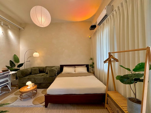 Inviting seating space for 2 to 4 guests, featuring a comfortable sofa and stylish coffee table. Amenities include hangers, an iron, a hair dryer, extra linens, towels, and board games, ensuring a cozy and entertaining stay for all guests.