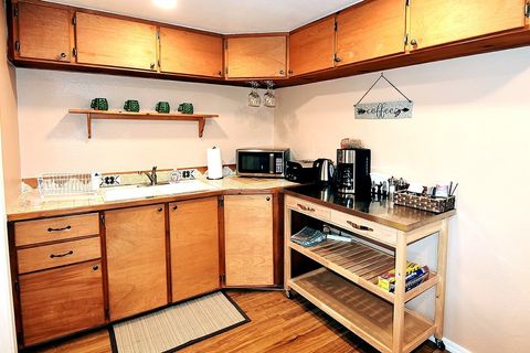 Kitchenette includes microwave, coffee maker, toaster, and electric tea kettle...plus plenty of coffee and tea to start your morning.
NOTE: Not a full kitchen; not intended for meal prep.