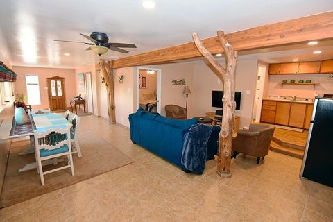 View of the entire apartment, approx. 825 sq. ft. An apartment-sized fridge is on the right.