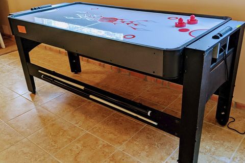 Game table flips from air hockey...